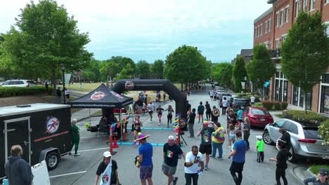 Runners-getting-medal-after-finishing-charity-run-in-american-neighborhood