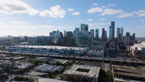 Drone-approaching-the-Houston-skyline-from-the-eastside-side,-in-sunny-Texas,-USA