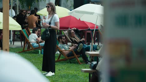 People-relaxing-on-deck-chairs-under-umbrellas-at-Zagreb's-Cest-is-d'Best-street-festival