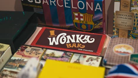 Collection-of-diverse-chocolate-bars,-including-a-Wonka-Bar-and-FCB-Barcelona-themed-chocolate,-at-Zagreb's-Chocolate-Museum