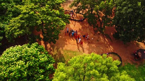 Jib-down-of-children-playing-in-a-park-in-rural-Africa