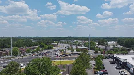 Shopping-center-in-american-suburb-with-parking-cars