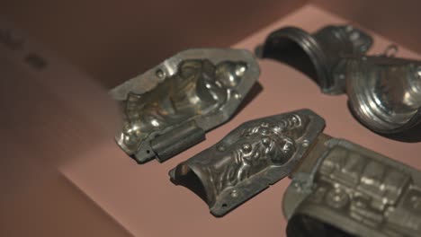 Close-up-of-vintage-metal-chocolate-molds-with-intricate-designs-displayed-at-Zagreb's-Chocolate-Museum