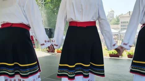 Bulgarian-folk-dance-group-stage-performance,-low-angle-view-feet-movement