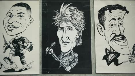 Black-and-white-caricatures-of-various-famous-personalities-displayed-at-Zagreb's-Cest-is-d'Best-street-festival