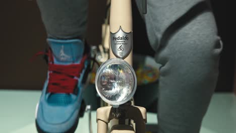 Close-up-of-a-visitor-pedaling-an-interactive-Pedaloo-exhibit-at-Zagreb's-Chocolate-Museum