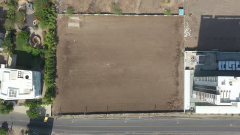 Drone-camera's-camera-shows-the-surroundings-of-a-large-farm-and-schools