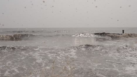 Water-waves-are-coming-into-the-camera-and-the-water-is-shining-with-sunlight