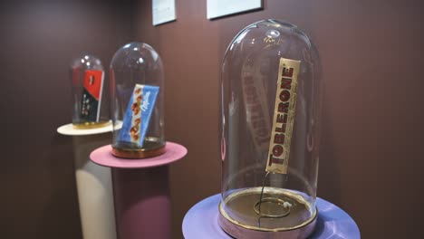 Iconic-chocolate-bars,-including-Toblerone,-displayed-in-glass-domes-at-Zagreb's-Chocolate-Museum