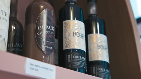 Assortment-of-chocolate-liqueur-bottles-displayed-on-a-shelf-at-Zagreb's-Chocolate-Museum