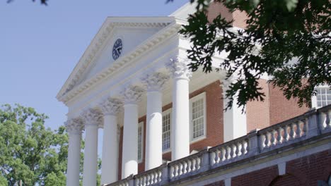 The-Rotunda-on-the-campus-of-the-University-of-Virginia-in-Charlottesville,-Virginia-with-a-pan-from-the-trees-to-the-building