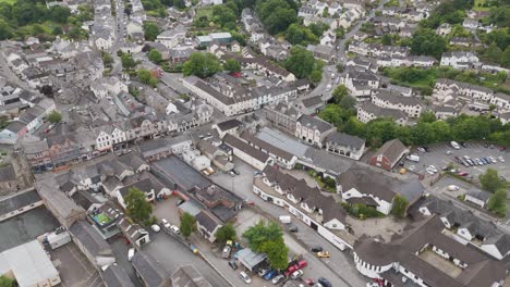 Aerial-view-of-the-central-area-of-Okehampton-town-in-Devon,-UK,-showcasing-residential-and-commercial-buildings