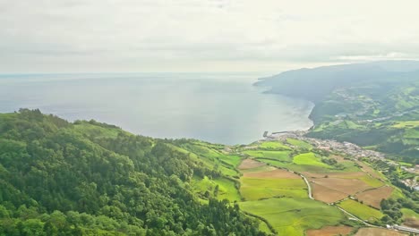 Aerial-wide-view-of-greenery-landscape-from-Pico-dos-Bodes-viewpoint-by-Atlantic-Ocean,-Azores