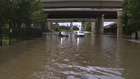 Drone-view-of-cars-in-flood-waters-after-Hurricane-Beryl-hits-Houston,-Texas