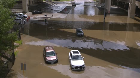 Drone-view-of-cars-in-flood-waters-after-Hurricane-Beryl-hits-Houston,-Texas