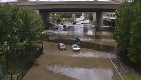 Drone-view-of-cars-in-flood-waters-after-Hurricane-Beryl-hits-Houston,-Texas