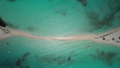 A-stunning-sandbar-connecting-two-beaches-with-turquoise-waters,-aerial-view