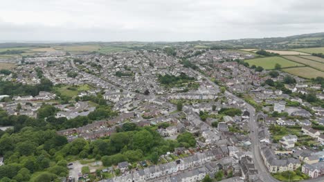 Aerial-view-of-residential-streets-in-Okehampton-Devon-UK,-showcasing-houses,-greenery,-and-town-layout