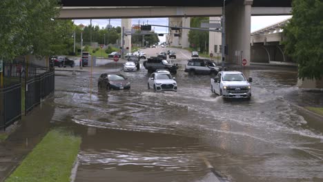 Drone-view-of-cars-in-flood-waters-after-Hurricane-Beryl-hits-Houston,-Texas