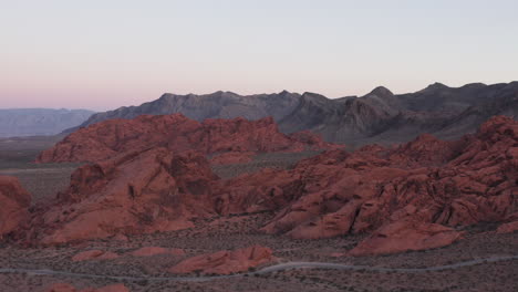 Aerial-pan-view-of-Valley-of-Fire-in-Nevada,-revealing-the-otherworldly-landscape,-Nevada,-Red-Sandstones