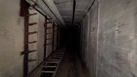 Exploring-underground-tunnel-bunker,-soviet-era-war-shelter-under-the-ground