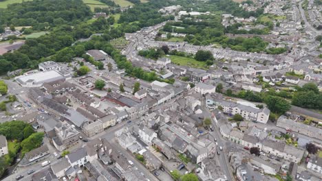 Aerial-view-of-Okehampton-town-centre-in-Devon-UK,-showing-buildings,-streets,-and-surrounding-landscape