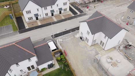 Aerial-view-of-heat-pump-being-installed-in-new-build-development-in-the-UK,-showing-construction-and-houses