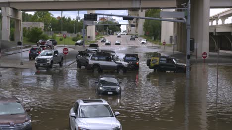 Drone-view-of-cars-in-flood-waters-after-Hurricane-Beryl-hits-Houston,-Texas