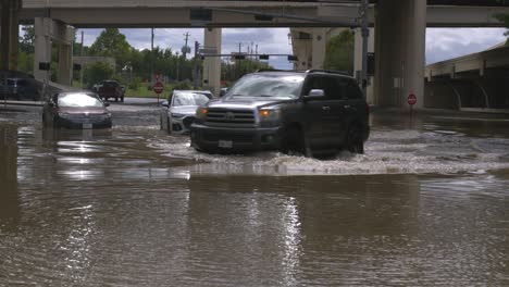 Drone-view-of-cars-in-flood-waters-after-Hurricane-Beryl-hits-Houston,-Texas