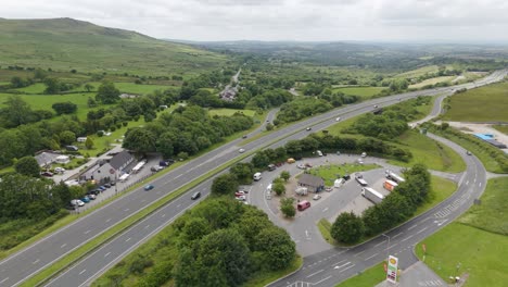 Aerial-view-of-the-A30-at-the-A386-turn-off-in-Devon,-showing-traffic-and-surrounding-greenery