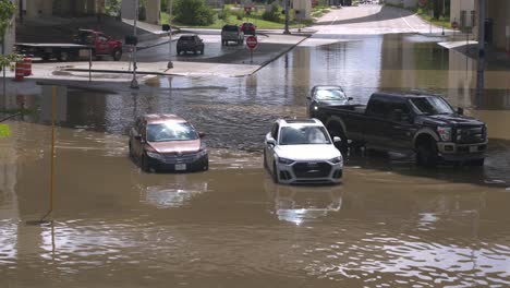 Drone-view-of-cars-in-flood-waters-after-Hurricane-Beryl-hits-Houston,-Texas