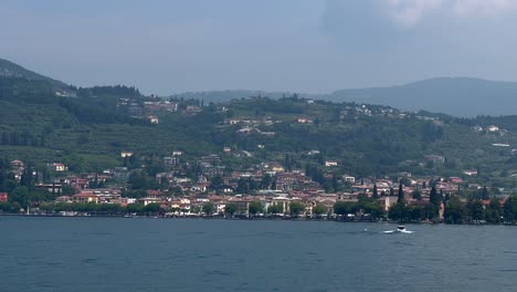 Aerial-wide-shot-showing-Italian-city-of-Bardolino-at-Lake-Garda