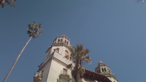 Gimbal-booming-down-and-panning-shot-of-the-ornate-Casa-Grande-at-Hearst-Castle-in-San-Simeon,-California