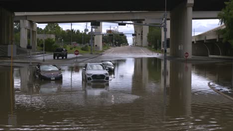 Drone-view-of-cars-in-flood-waters-after-Hurricane-Beryl-hits-Houston,-Texas