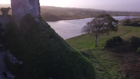 Aerial-rising-over-Menlo-Castle,-ending-with-River-Corrib-view