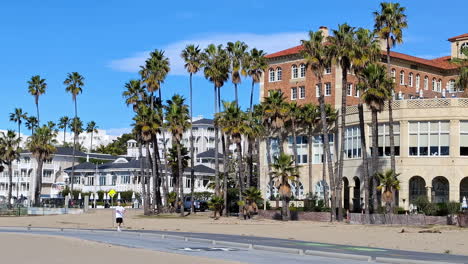 People-walking-on-Venice-beach-strip-in-United-States,-laid-back-community