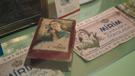 display-of-vintage-chocolate-packaging-at-the-Zagreb-Chocolate-Museum,-featuring-illustrated-wrappers-and-old-fashioned-designs