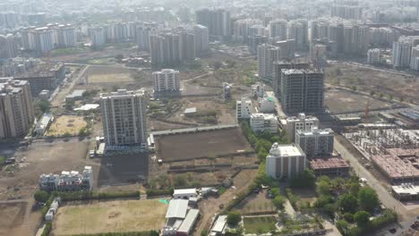 Many-vehicles-and-high-rise-buildings-in-the-distance-are-visible-inside-the-aerial-camera