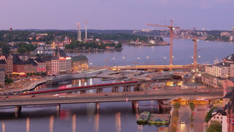 Construction-site-between-Slussbron-and-Centralbron-in-Stockholm,-twilight-drone