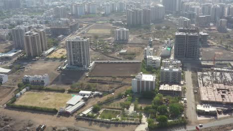 Drone-camera-showing-lots-of-vehicles-and-lots-of-high-rise-buildings