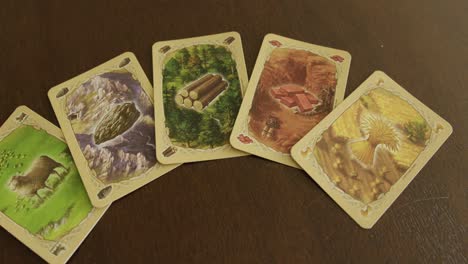 Close-Up-Pan-Right-of-Catan-Resource-Cards-on-a-Table