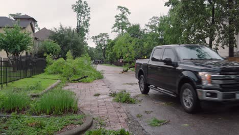 Trees-and-debris-partially-block-road-in-neighborhood-after-Hurricane-Beryl-strikes-Houston,-Texas