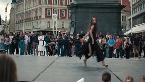 dancer-in-a-black-dress-performing-on-an-outdoor-stage-in-front-of-an-audience-at-Zagreb's-Cest-is-d'Best-street-festival