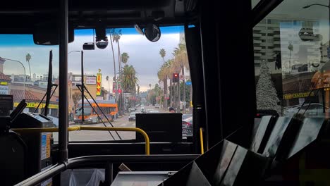 Riding-on-Bus-on-Hollywood-Boulevard,-Walk-of-Fame,-Los-Angeles,-California-USA