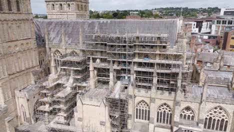 Aerial-of-extensive-restoration-works-to-Exeter-City-Cathedral,-Exeter,-Devon,-UK,-July-2024