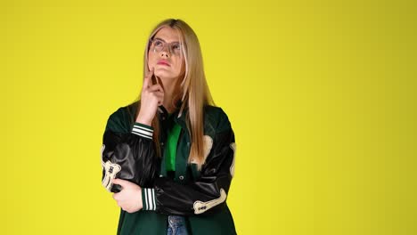 Portrait-Of-Thoughtful-Blonde-Student-Woman,-Thinking-and-Uncertain-Gesture-Expression,-Colorful-Studio-Shot