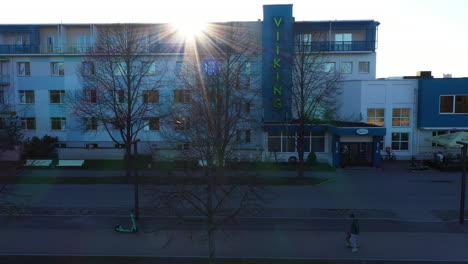 Viiking-SPA-Hotel-entrance-in-aerial-sliding-shot-in-golden-hour-sunlight