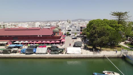 Aerial-view-of-Iconic-Olhao-Market-by-the-Ria-Formosa,-Dolly-sideways