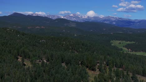 Spring-Summer-Mount-Blue-Sky-Evans-aerial-drone-Conifer-Evergreen-Colorado-snowmelt-sunny-morning-Rocky-Mountains-landscape-North-Turkey-Creek-Marshdale-Forest-Open-Space-forward-reveal-motion