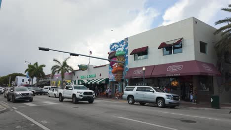 Street-view-of-Little-Havana-in-Miami,-showcasing-vibrant-murals-and-busy-shops